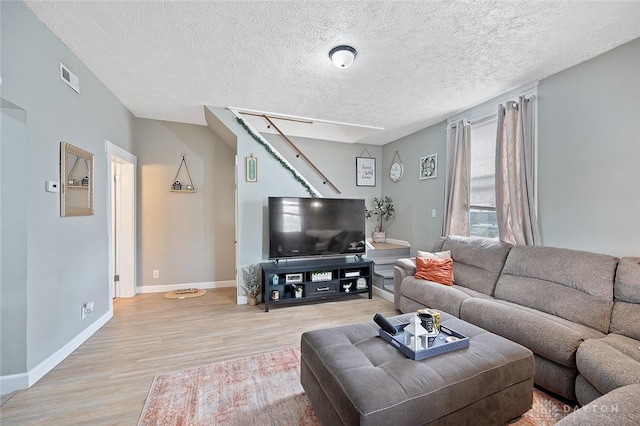 131 S Mulberry St, Troy, OH 45373 - living area with light wood-type flooring and a textured ceiling