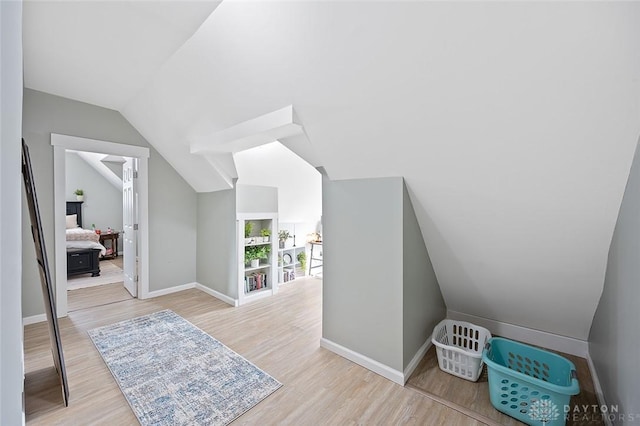 131 S Mulberry St, Troy, OH 45373 - additional living space with wood finished floors and vaulted ceiling