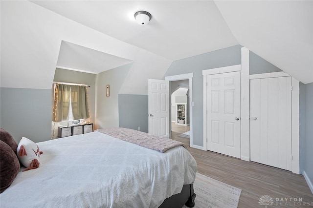 131 S Mulberry St, Troy, OH 45373 - bedroom featuring wood finished floors and lofted ceiling