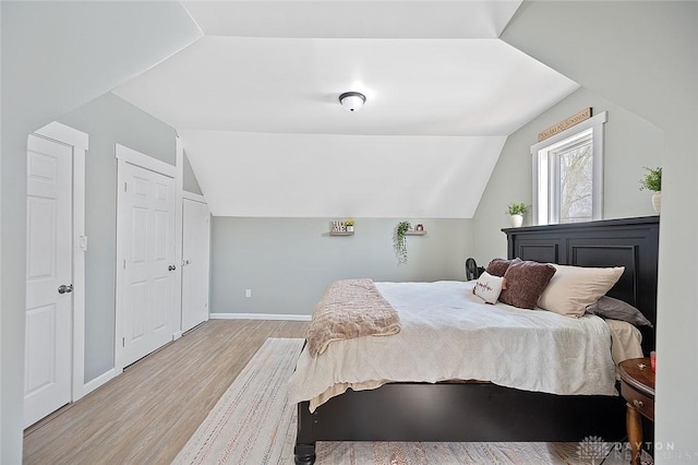 131 S Mulberry St, Troy, OH 45373 - bedroom featuring light wood-style floors and vaulted ceiling