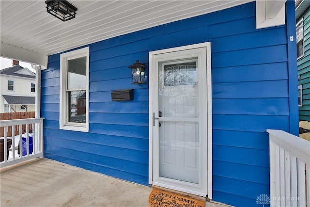 doorway to property with a porch
