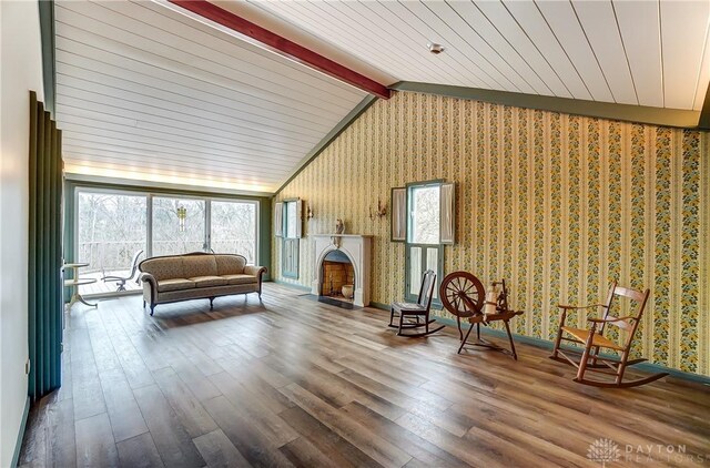 1831 Fairfield Pike, Springfield, OH 45502 - interior space with a fireplace with flush hearth, wallpapered walls, vaulted ceiling with beams, and wood finished floors