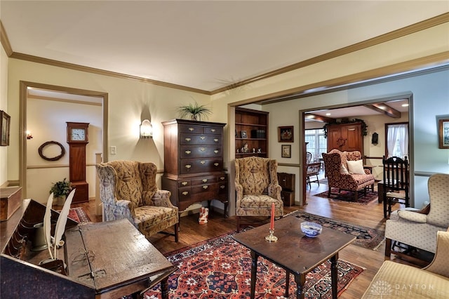 living area with wood finished floors and crown molding