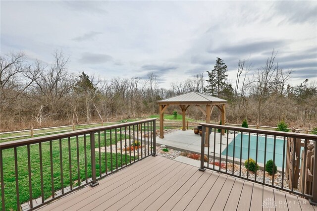 deck featuring a lawn and a gazebo