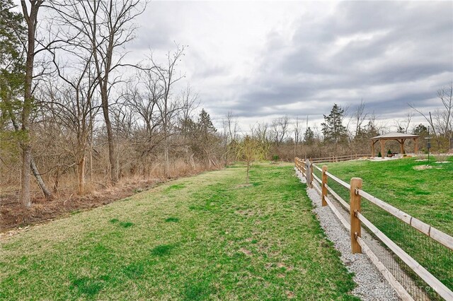 view of yard featuring a gazebo and fence