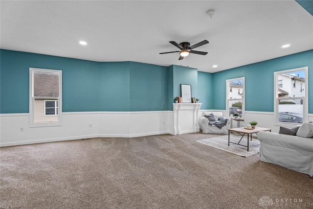 1546 W 1st St, Dayton, OH 45402 - carpeted living area featuring ceiling fan, a wainscoted wall, and recessed lighting