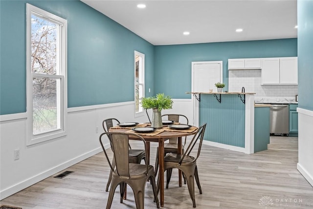 1546 W 1st St, Dayton, OH 45402 - dining space featuring light wood-style floors and recessed lighting