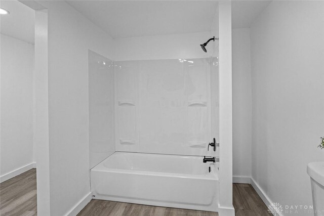 1546 W 1st St, Dayton, OH 45402 - bathroom with wood finished floors, bathtub / shower combination, and recessed lighting