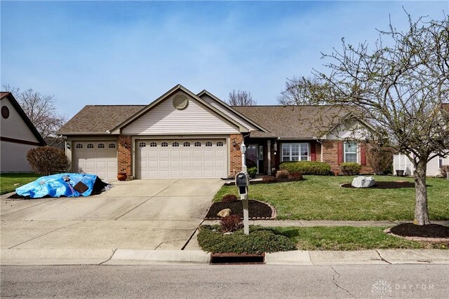 ranch-style home with a front yard, driveway, a shingled roof, a garage, and brick siding