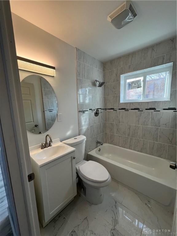 225 Victor Ave, Dayton, OH 45405 - full bathroom featuring toilet, shower / bathtub combination, vanity, and marble finish floors