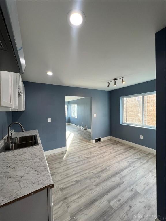 225 Victor Ave, Dayton, OH 45405 - kitchen with a sink, open floor plan, extractor fan, light wood-style floors, and recessed lighting