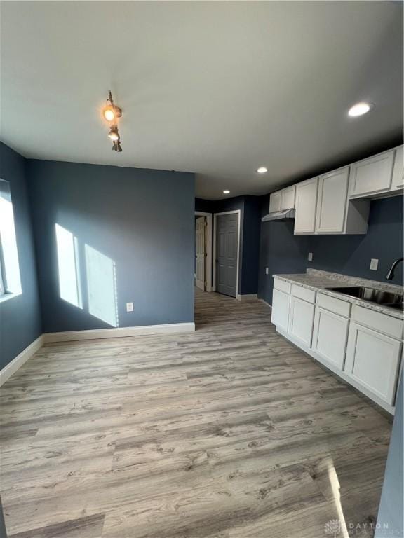 225 Victor Ave, Dayton, OH 45405 - kitchen with baseboards, white cabinets, a sink, light wood-type flooring, and recessed lighting
