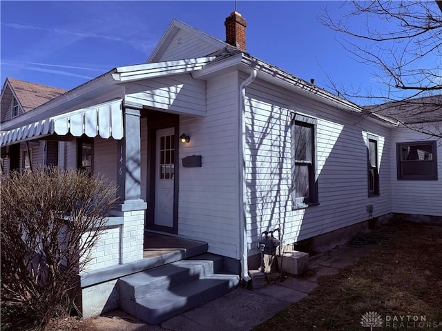 exterior space featuring a chimney