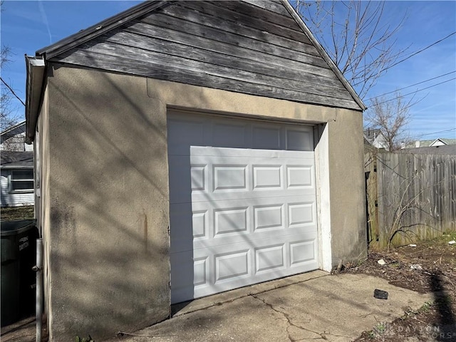 detached garage with fence