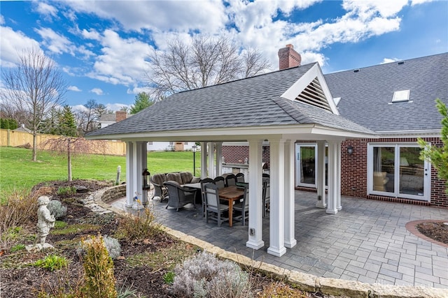 view of patio / terrace with fence and an outdoor living space