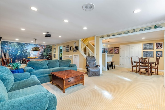 living area featuring baseboards, recessed lighting, ornamental molding, and stairs