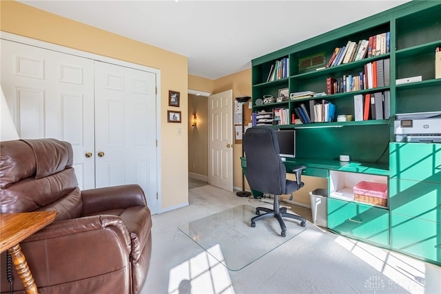office with carpet floors and baseboards