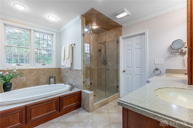 bathroom with a shower stall, crown molding, double vanity, a garden tub, and tile patterned flooring