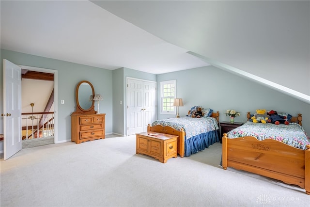 bedroom featuring a closet, carpet flooring, and baseboards