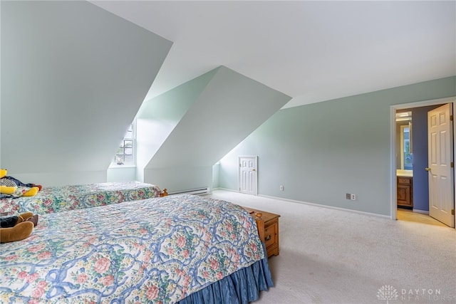 bedroom featuring baseboards, lofted ceiling, and carpet