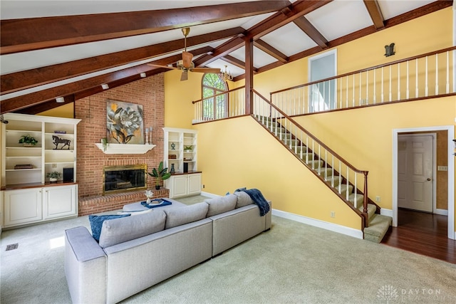 533 Lockerbie Ln, Kettering, OH 45429 - living room featuring a ceiling fan, carpet flooring, beamed ceiling, high vaulted ceiling, and stairs