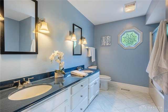 533 Lockerbie Ln, Kettering, OH 45429 - bathroom with double vanity, toilet, and baseboards