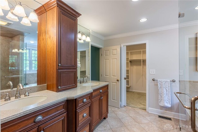 533 Lockerbie Ln, Kettering, OH 45429 - full bathroom featuring double vanity, tile patterned flooring, a spacious closet, a chandelier, and crown molding