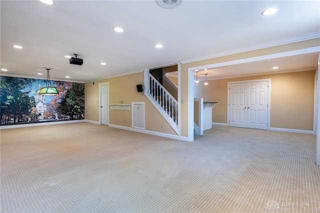 533 Lockerbie Ln, Kettering, OH 45429 - empty room featuring light colored carpet, ornamental molding, stairs, baseboards, and recessed lighting