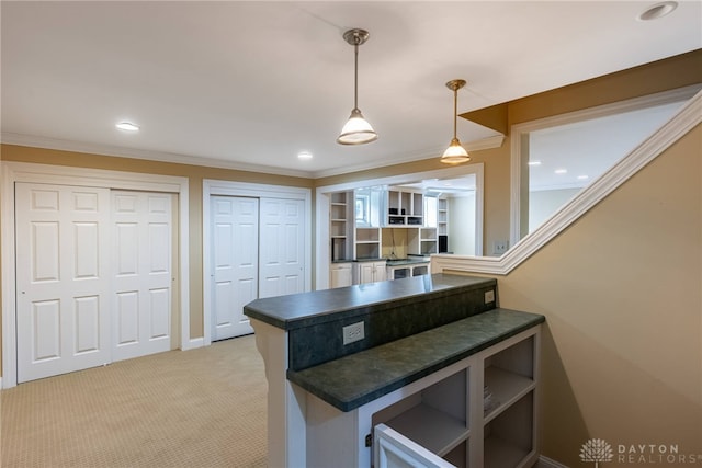 533 Lockerbie Ln, Kettering, OH 45429 - kitchen with dark countertops, ornamental molding, open shelves, light carpet, and hanging light fixtures