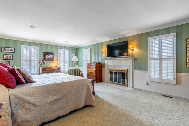 533 Lockerbie Ln, Kettering, OH 45429 - carpeted bedroom with ornamental molding, multiple windows, and a high end fireplace