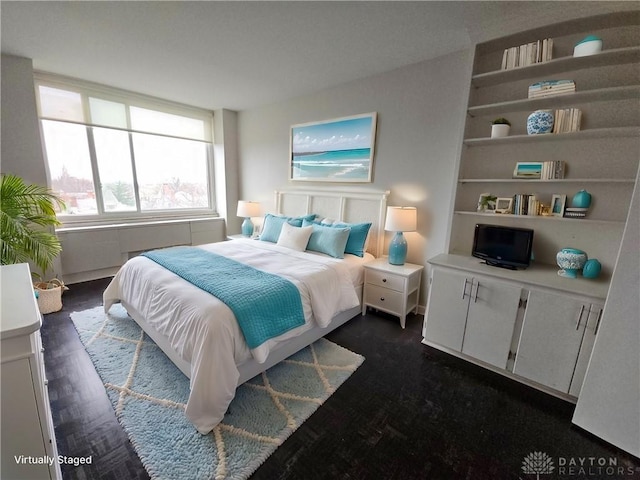 bedroom featuring dark wood-type flooring