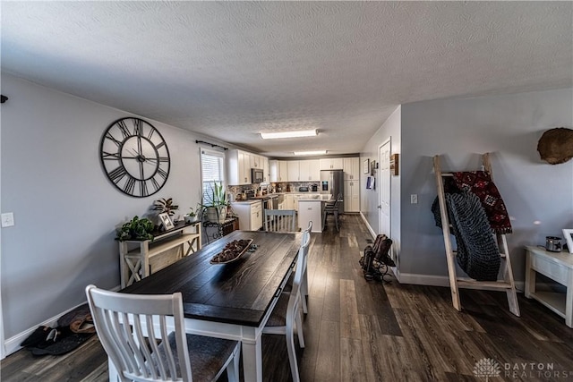 dining area featuring baseboards, a textured ceiling, and dark wood-style flooring