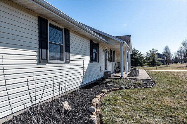 view of property exterior featuring a lawn