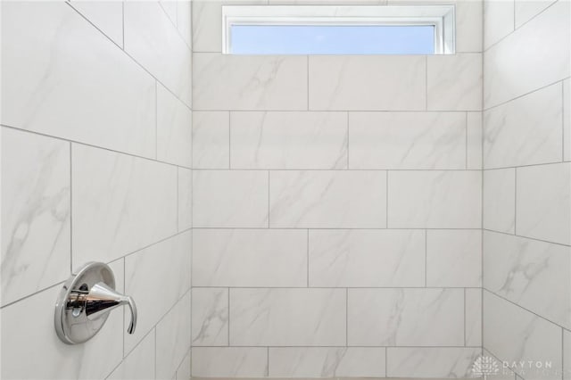 details with a tile shower