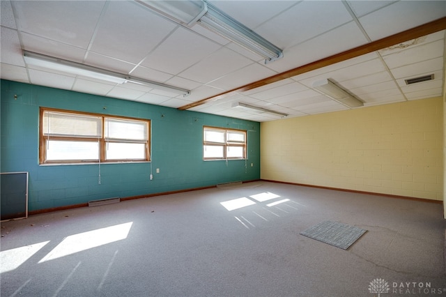 531 W Ash St, Piqua, OH 45356 - empty room featuring carpet floors and concrete block wall