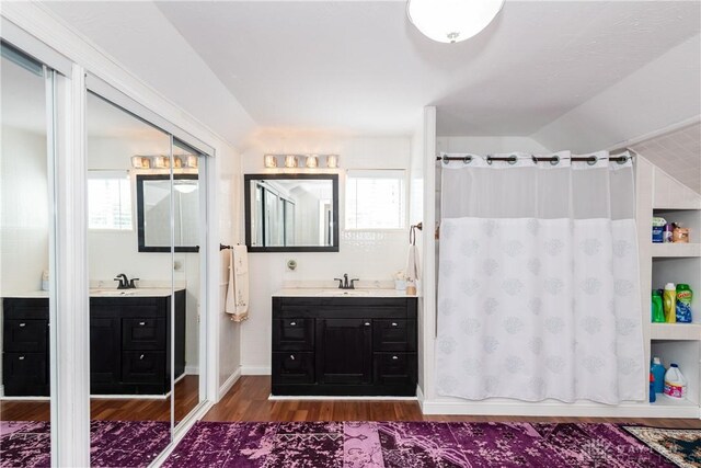 82 Notre Dame Ave, Dayton, OH 45404 - full bath with wood finished floors, vanity, plenty of natural light, and curtained shower