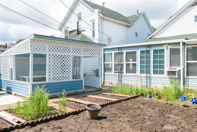82 Notre Dame Ave, Dayton, OH 45404 - back of house featuring a sunroom and cooling unit