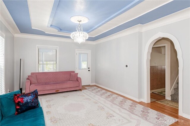 82 Notre Dame Ave, Dayton, OH 45404 - living room featuring wood finished floors, a chandelier, stairs, and a tray ceiling