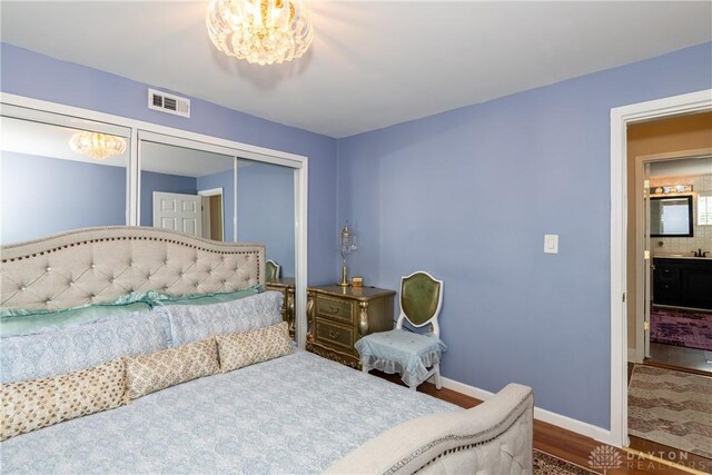 82 Notre Dame Ave, Dayton, OH 45404 - bedroom featuring dark wood-style flooring, a closet, and baseboards