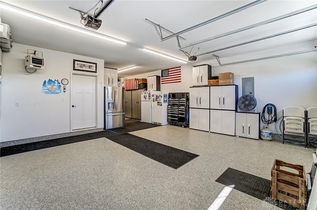 703 Doral Ct, Dayton, OH 45458 - garage with stainless steel fridge, electric panel, and a garage door opener