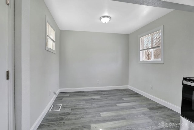 interior space featuring plenty of natural light, baseboards, and visible vents