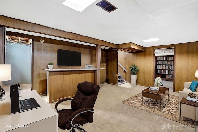 office space with wooden walls