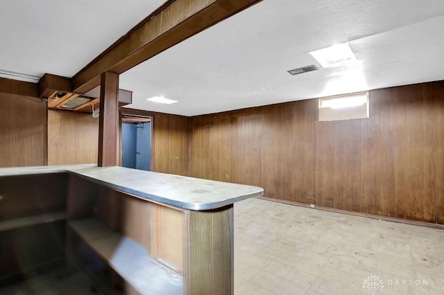 bar with wooden walls and light floors
