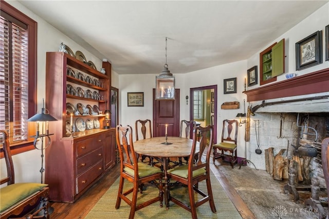 dining area with wood finished floors