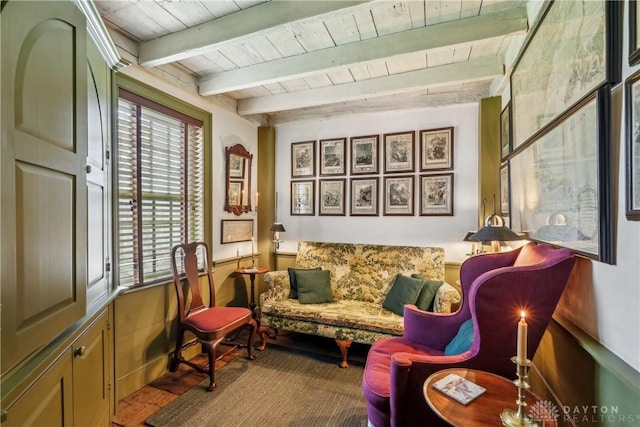 living area with wood ceiling and beam ceiling