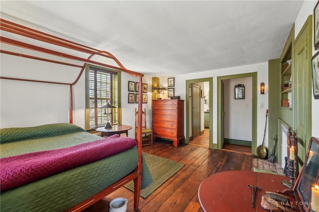bedroom with wood-type flooring