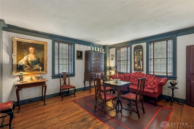 dining room with baseboards and wood-type flooring
