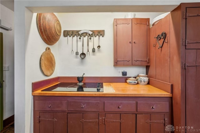 kitchen with black electric cooktop