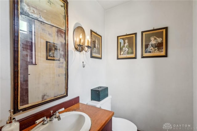 bathroom featuring toilet and vanity