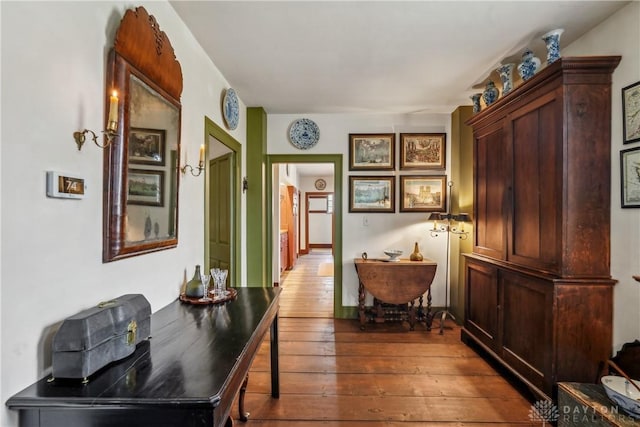 hall with dark wood-type flooring